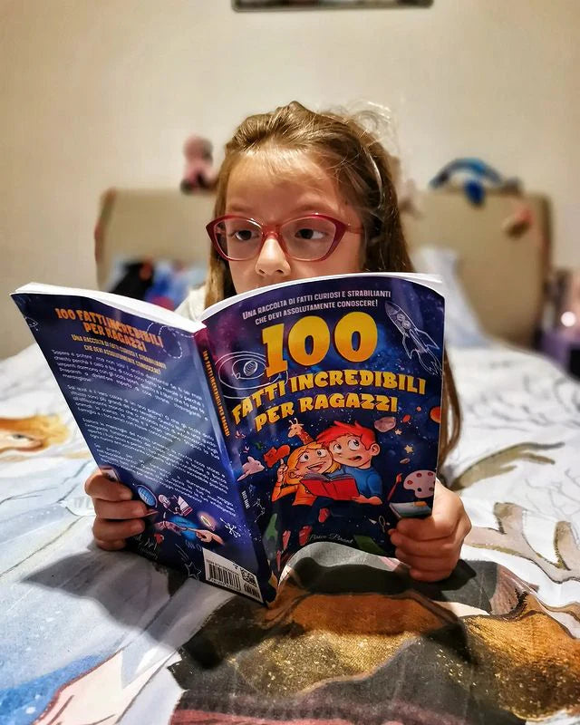 A girl reading 100 Fatti Incredibili per Ragazzi