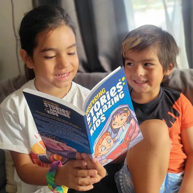 Two children reading Inspiring Stories for Amazing Kids together