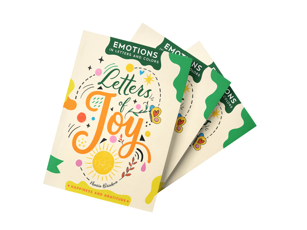 Three copies of Letters of Joy fanned out: cream covers with an orange sun.