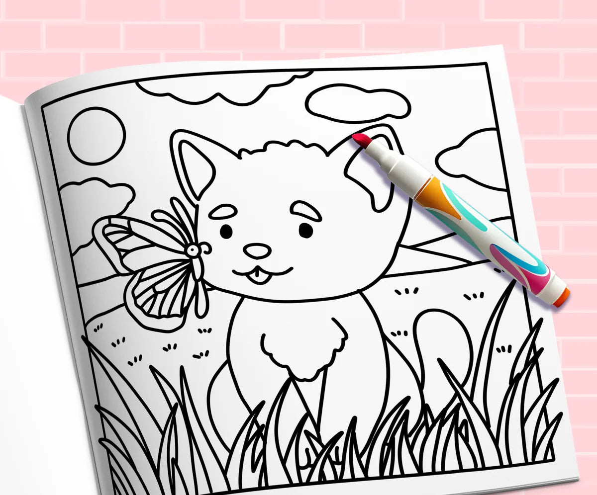 Open book: a kitten in the grass with a butterfly