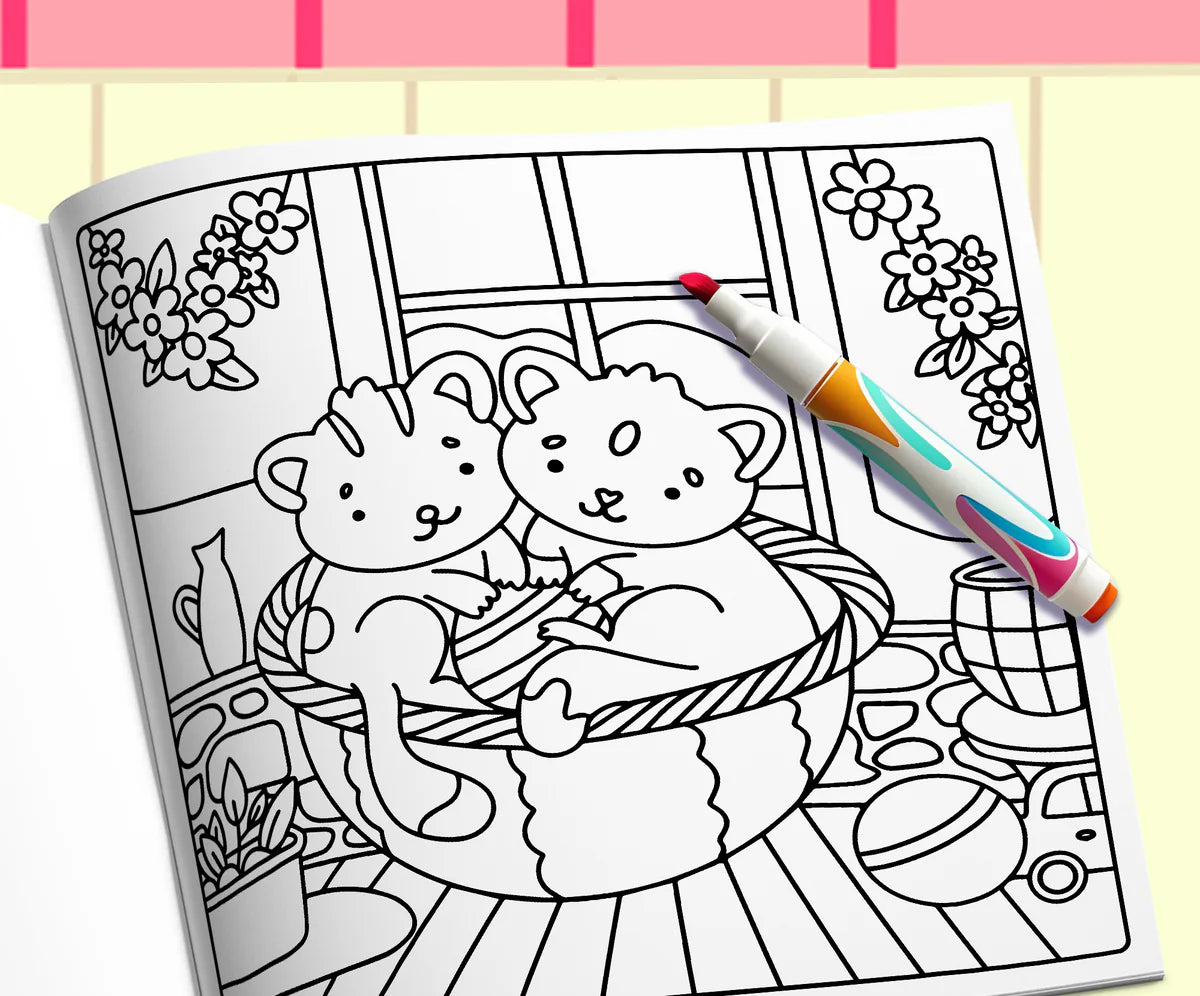 Open book: two kittens in a basket on a table