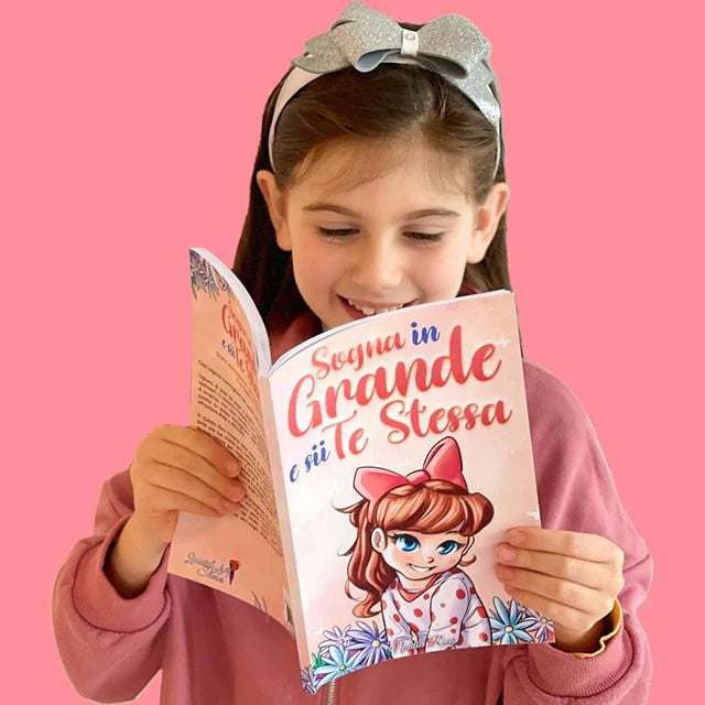 A girl reading Sogna in Grande e Sii Te Stessa